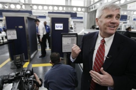 Eddie Mayenschein, Transportation Security Administration, Office of Security, General Manager, narrates procedures as volunteers go through the first full body scanner installed at O'Hare International Airport , Monday, March 15, 2010, in Chicago. Federal transportation authorities demonstrated the technology to the media before starting to send passengers through the machine later today. Officials say they don't expect the body scanner which takes seconds to pass through to slow down security lines. (AP Photo/M. Spencer Green)