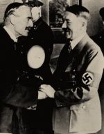 Chamberlain and Adolf Hitler shaking hands after meeting in Germany. Image courtesy of Neville Chamberlain Biography